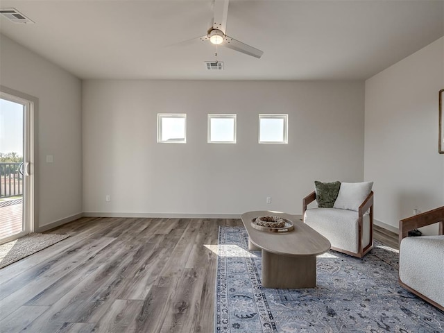 unfurnished room with ceiling fan and light hardwood / wood-style floors