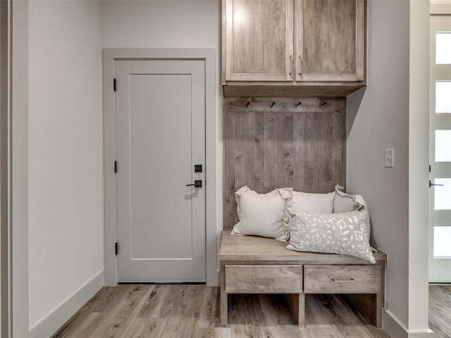 mudroom with light hardwood / wood-style floors