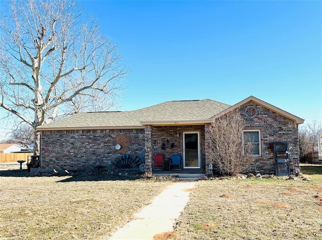 ranch-style home with a front lawn