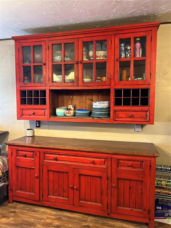 bar with hardwood / wood-style flooring