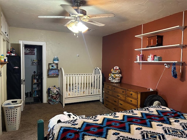 carpeted bedroom with ceiling fan