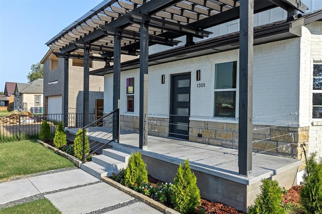 entrance to property with a pergola