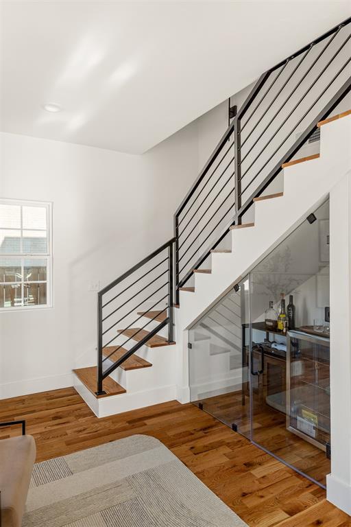 staircase featuring wood-type flooring