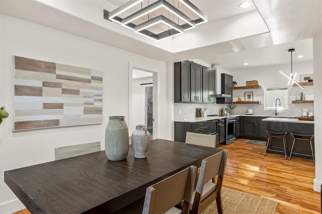 dining space with light hardwood / wood-style floors