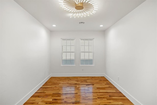 unfurnished room featuring wood-type flooring