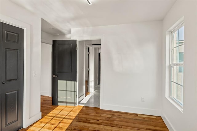 unfurnished room featuring hardwood / wood-style floors