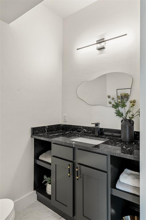 bathroom with vanity and toilet