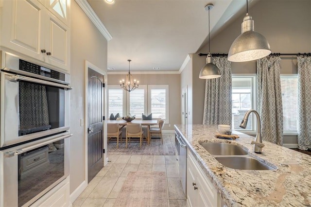 kitchen featuring sink, stainless steel appliances, light stone counters, white cabinets, and light tile patterned flooring