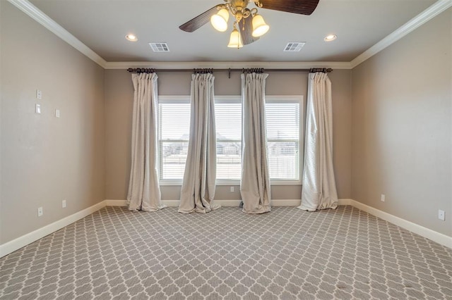 spare room featuring ornamental molding and ceiling fan