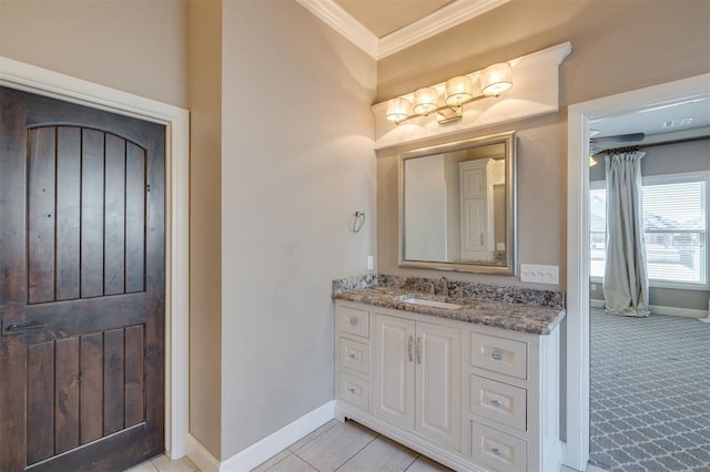 bathroom with ornamental molding and vanity