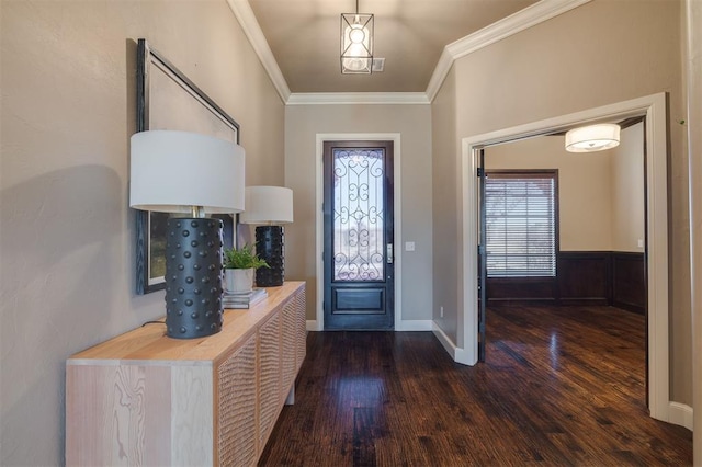 foyer entrance featuring ornamental molding and dark hardwood / wood-style floors