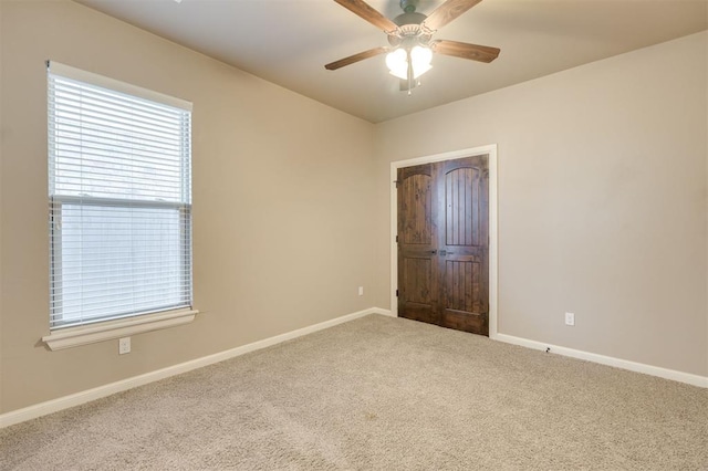 unfurnished room featuring carpet and ceiling fan