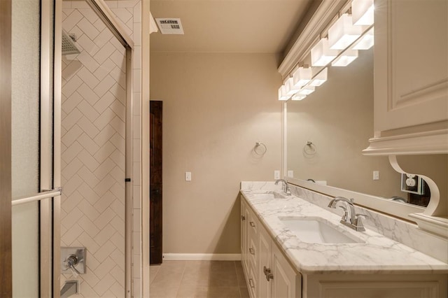 bathroom featuring tile patterned flooring and vanity