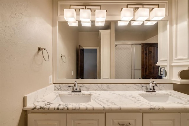 bathroom featuring vanity and an enclosed shower