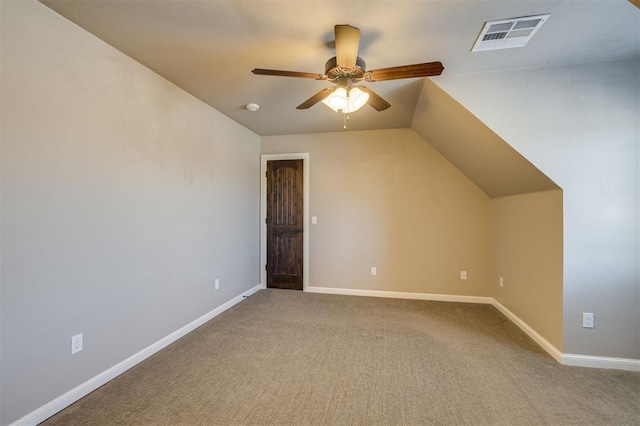 additional living space featuring vaulted ceiling, carpet floors, and ceiling fan