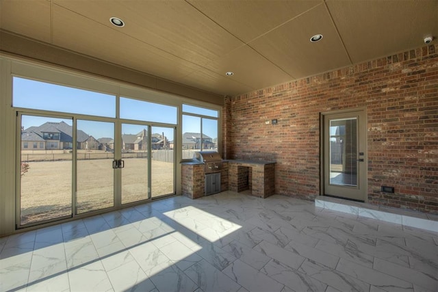 unfurnished sunroom with wood ceiling