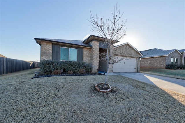 view of front of house with a garage and a front lawn