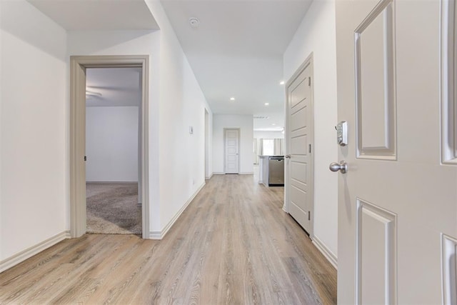 hallway with light wood-type flooring