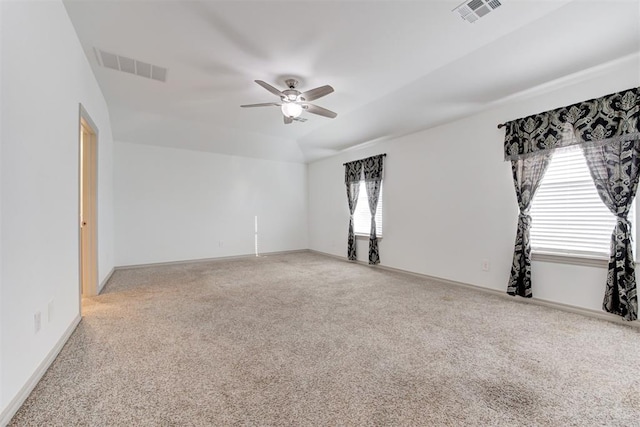 unfurnished room with lofted ceiling, carpet flooring, and ceiling fan