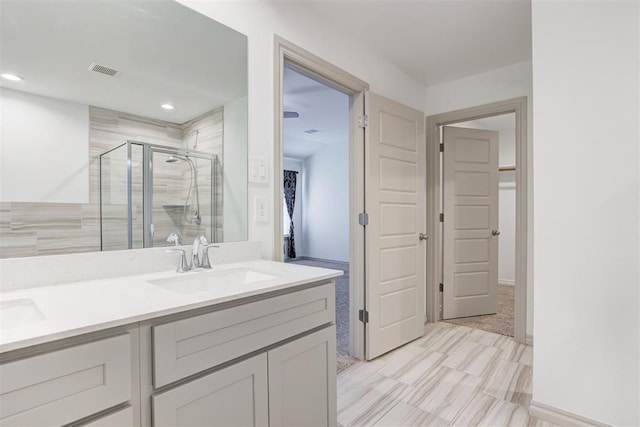 bathroom with vanity and walk in shower