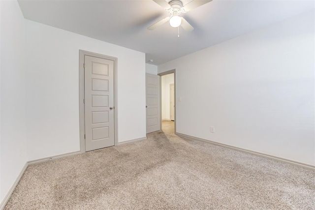 unfurnished room featuring carpet floors and ceiling fan