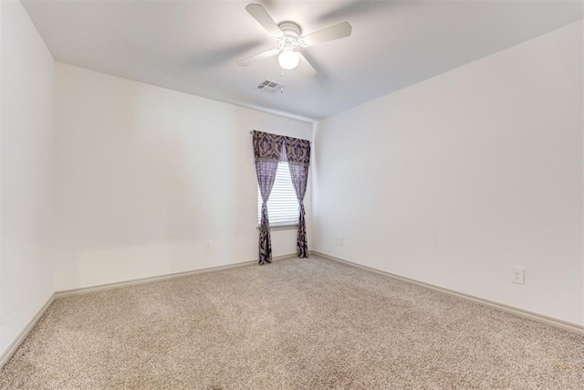 unfurnished room with ceiling fan and carpet flooring