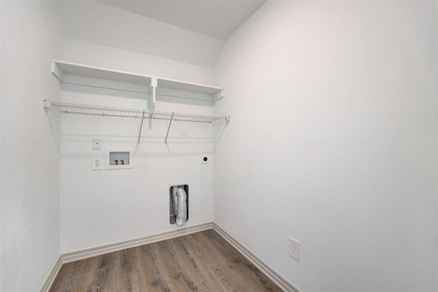 laundry area featuring electric dryer hookup, hardwood / wood-style floors, and hookup for a washing machine