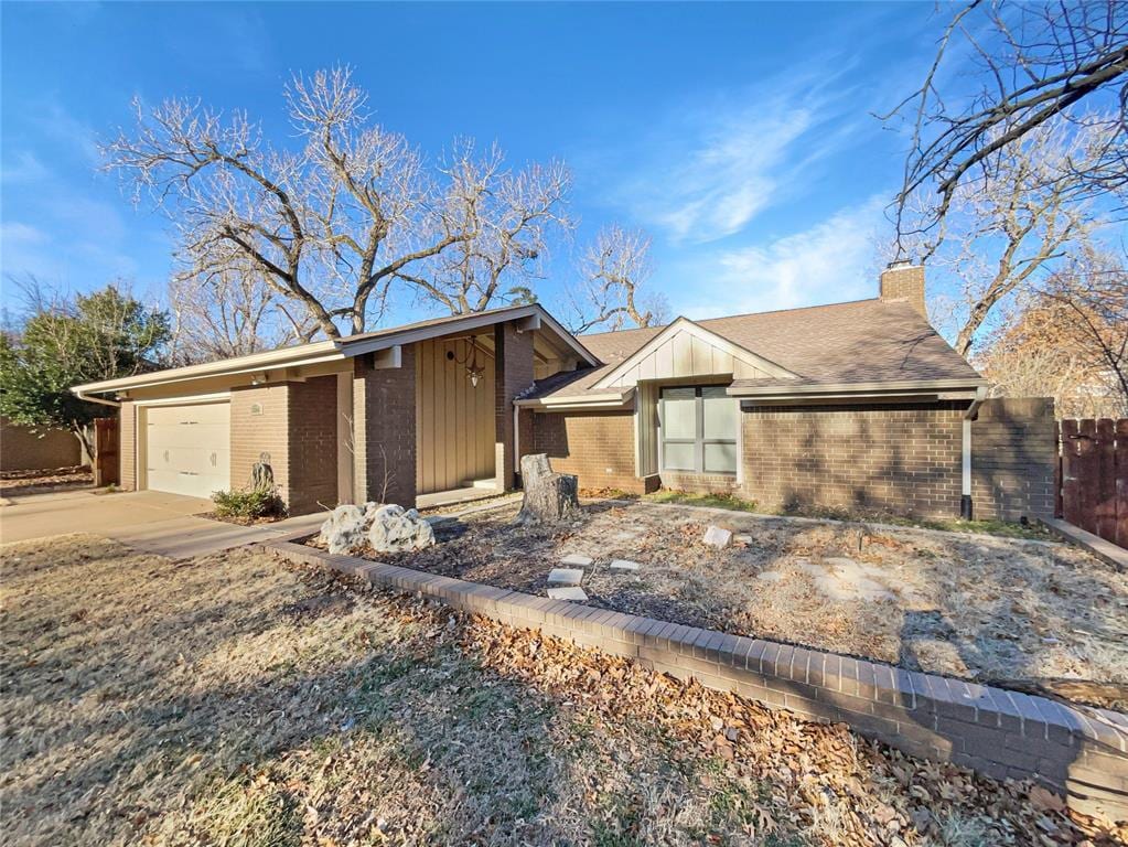 ranch-style house featuring a garage