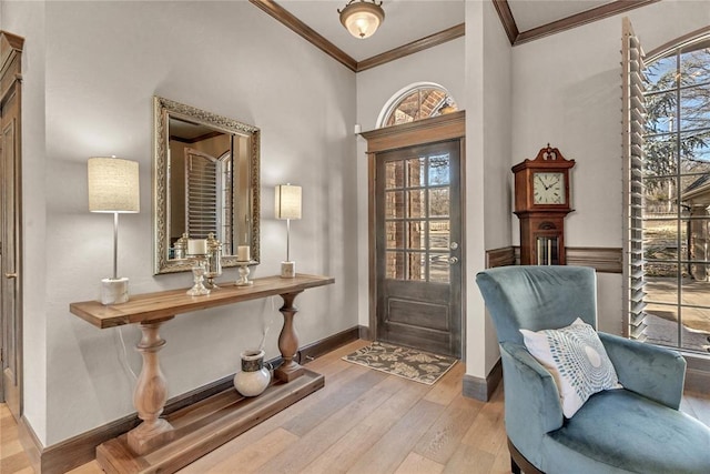 interior space featuring ornamental molding, a wealth of natural light, and light wood-type flooring