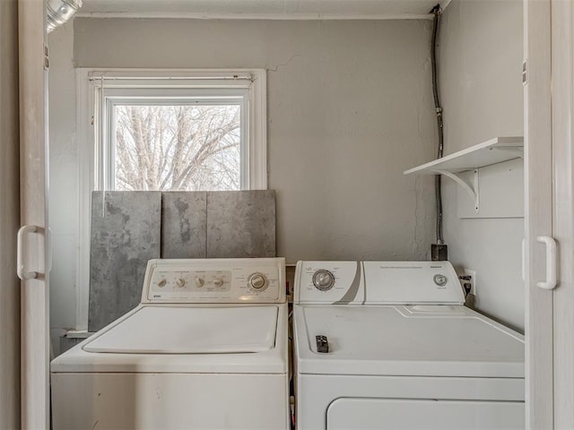 clothes washing area featuring laundry area and independent washer and dryer