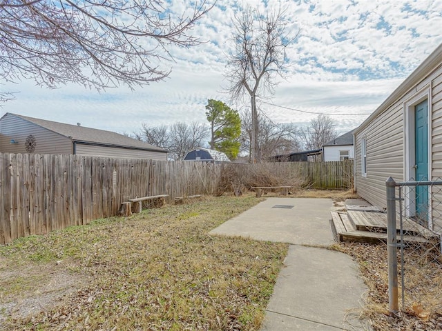 view of yard featuring a patio and a fenced backyard