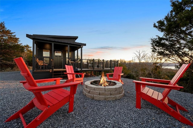 playground at dusk with an outdoor fire pit