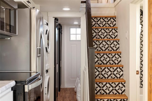 kitchen with hardwood / wood-style flooring, appliances with stainless steel finishes, and white cabinets