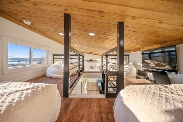 bedroom with vaulted ceiling, wooden ceiling, and wood-type flooring