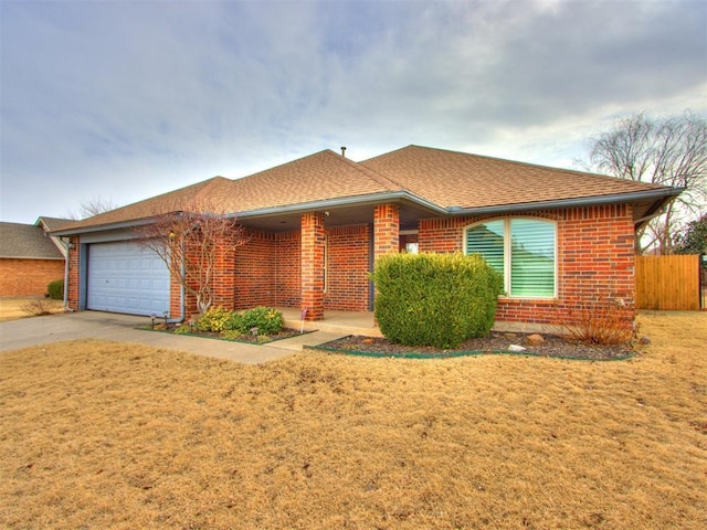 view of front of home with a garage and a front lawn