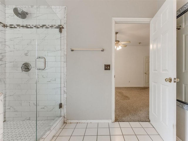 bathroom with tile patterned floors, an enclosed shower, and ceiling fan