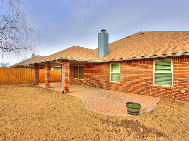 rear view of property featuring a patio