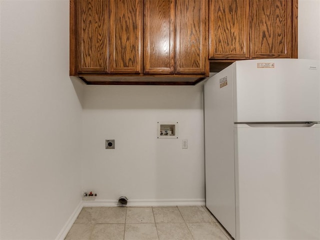 laundry area with cabinets, gas dryer hookup, hookup for an electric dryer, and washer hookup