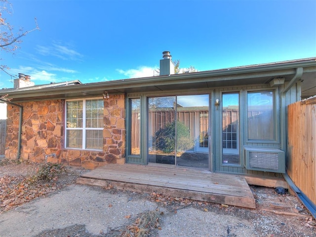 rear view of house with a wooden deck