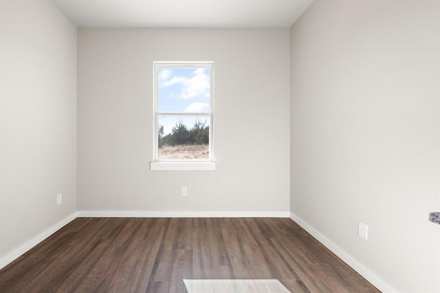 empty room with dark hardwood / wood-style floors