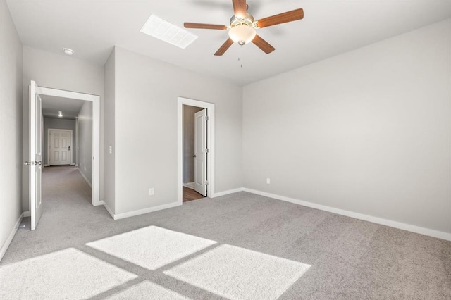 unfurnished bedroom featuring ensuite bathroom, ceiling fan, and carpet