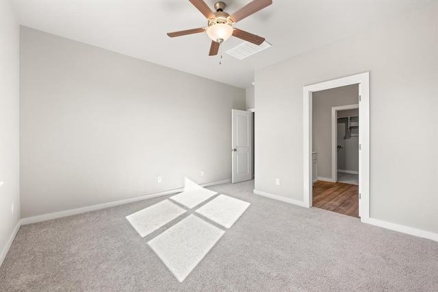 unfurnished bedroom featuring light colored carpet and ceiling fan