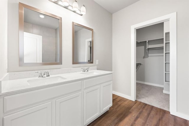 bathroom with vanity and hardwood / wood-style floors