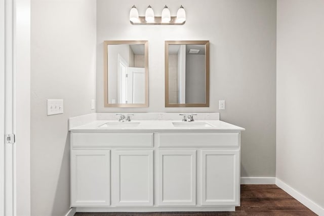 bathroom with vanity and hardwood / wood-style floors