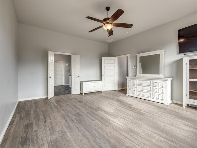 unfurnished bedroom featuring light hardwood / wood-style floors and ceiling fan