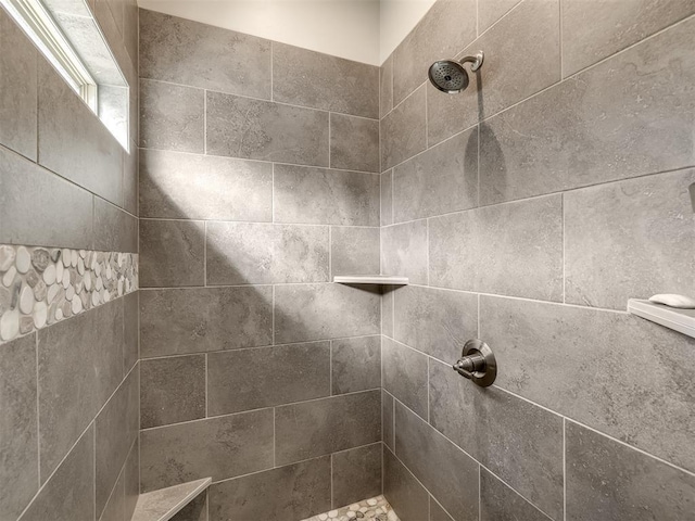 details featuring a tile shower