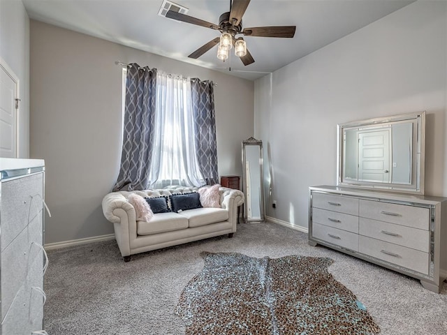 sitting room with light colored carpet and ceiling fan