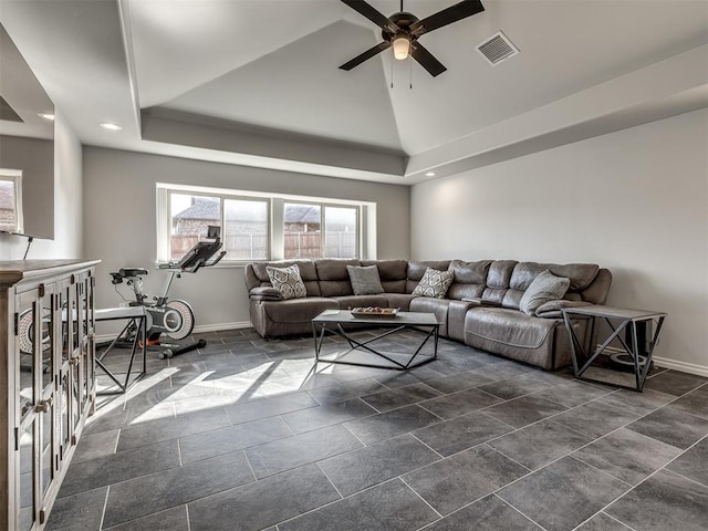 living room featuring high vaulted ceiling, a raised ceiling, and ceiling fan