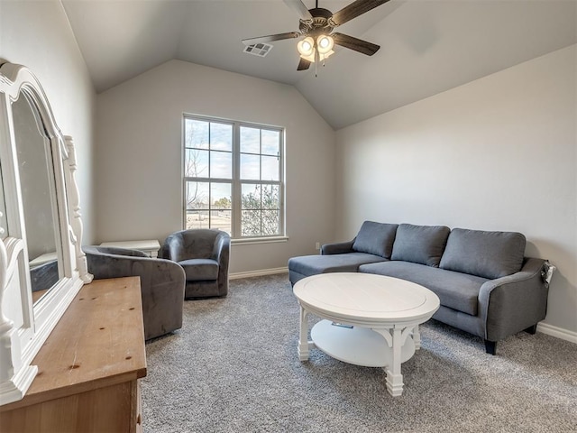 living room featuring ceiling fan, lofted ceiling, and carpet flooring