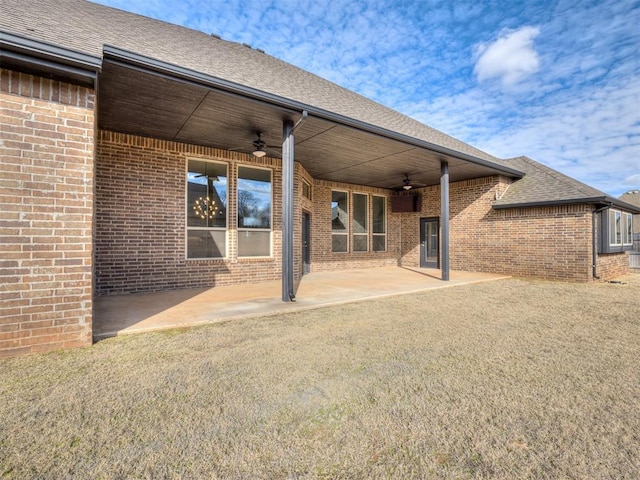 back of house with ceiling fan and a patio area